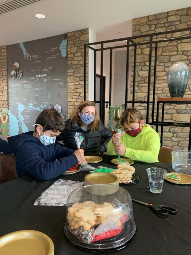 family decorating christmas cookies